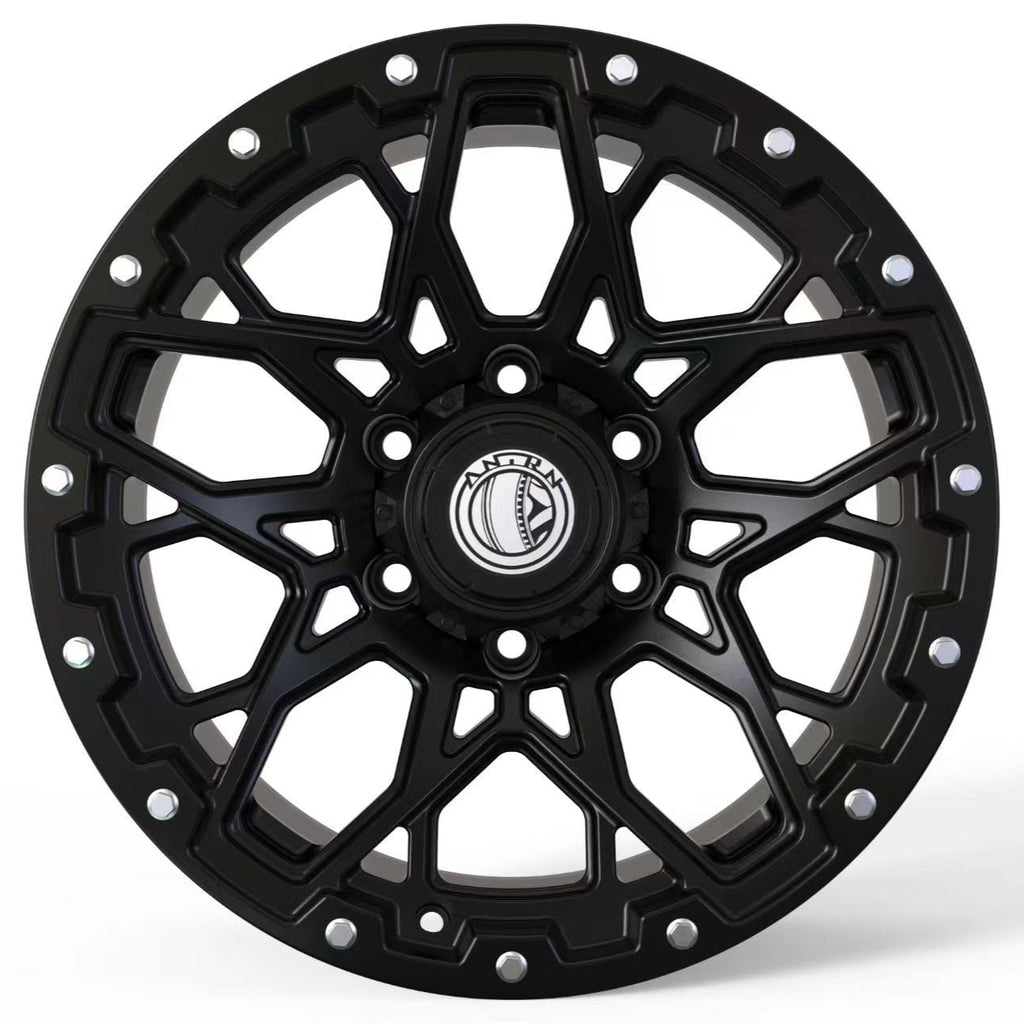 Black alloy wheel on a white background