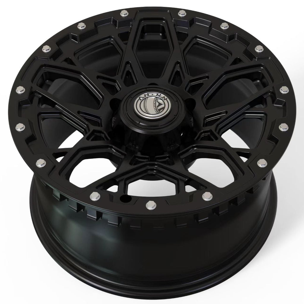Black alloy wheel on a white background