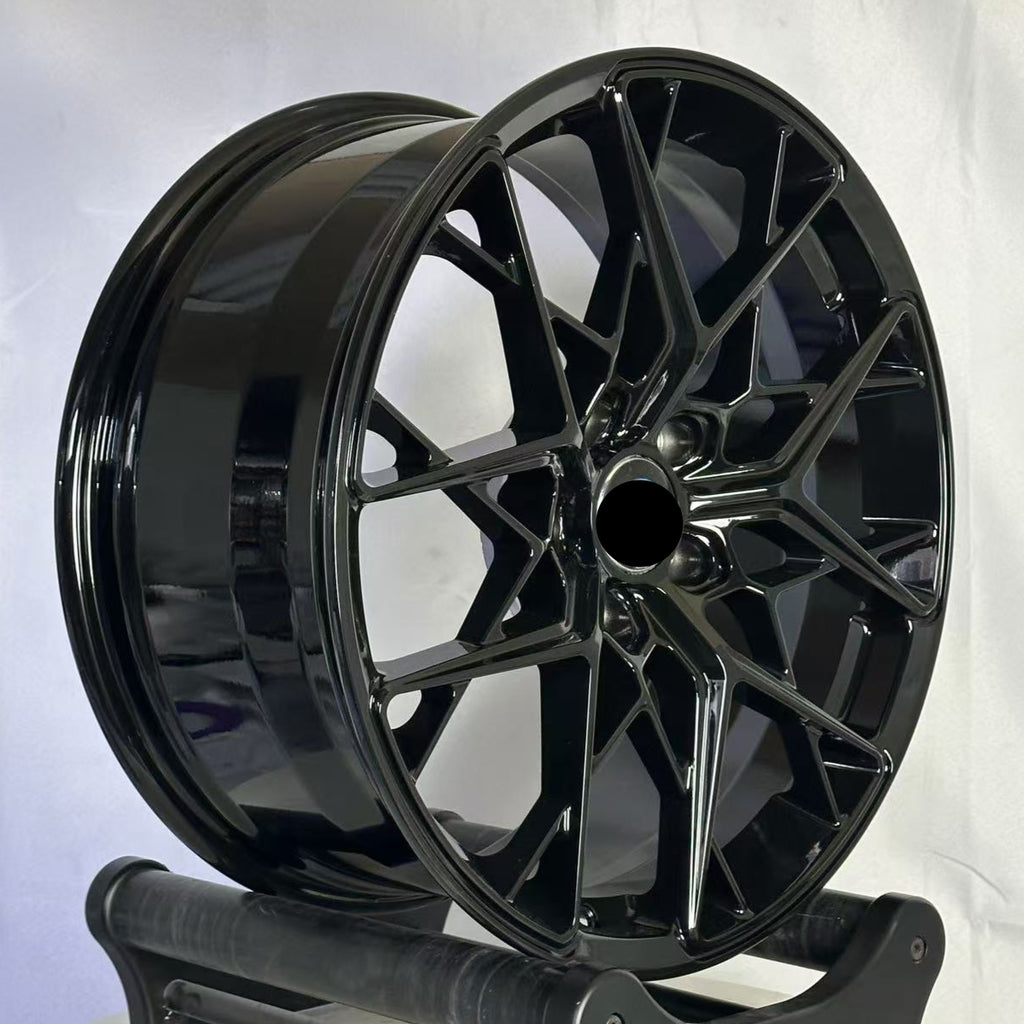 Black wheel on a stand against a white background