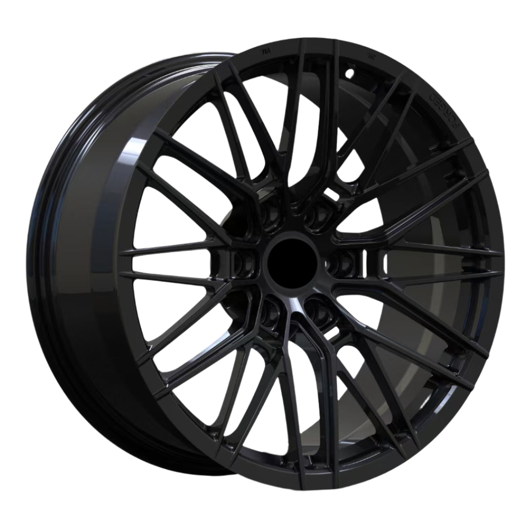 Black alloy wheel on a white background